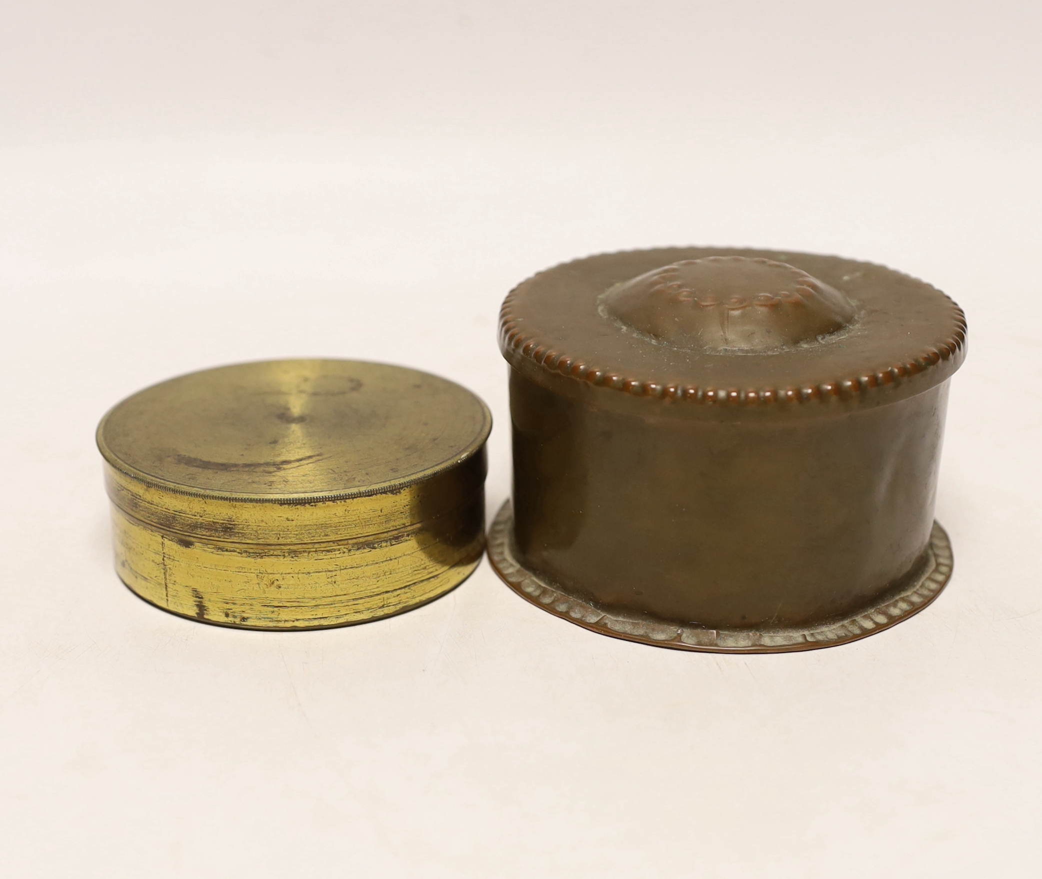 A small circular John Pearson copper box, stamped on base, together with a compass, Pearson box 10cms diameter